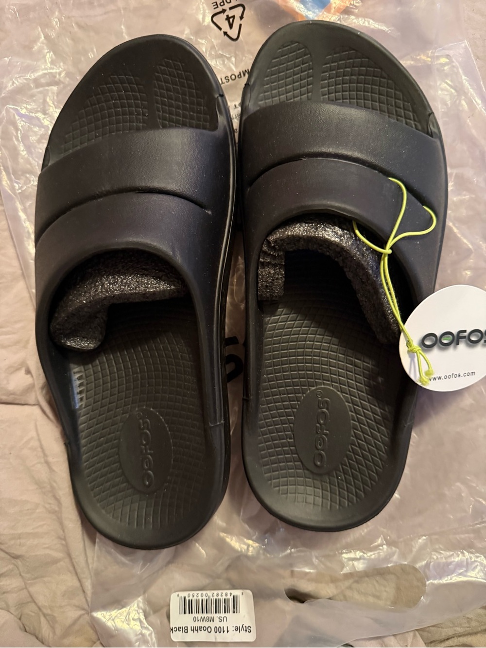 These are unisex men’s eight women’s 10  OOFOS Black Slip-On Recovery Sandals